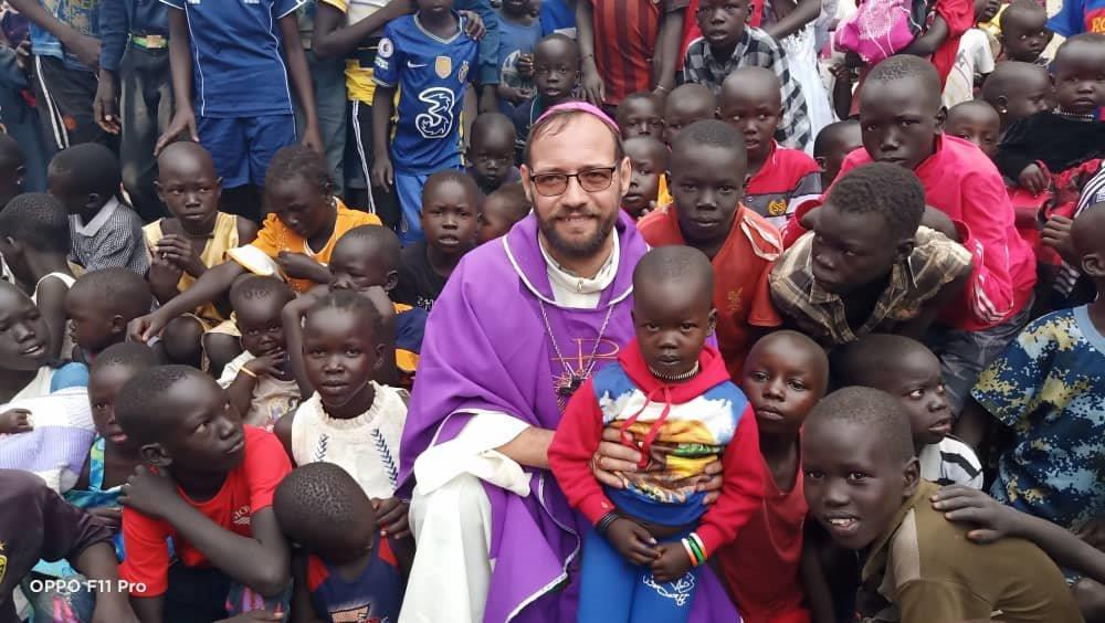 Bishop Christian Carlassare with children of the diocese
